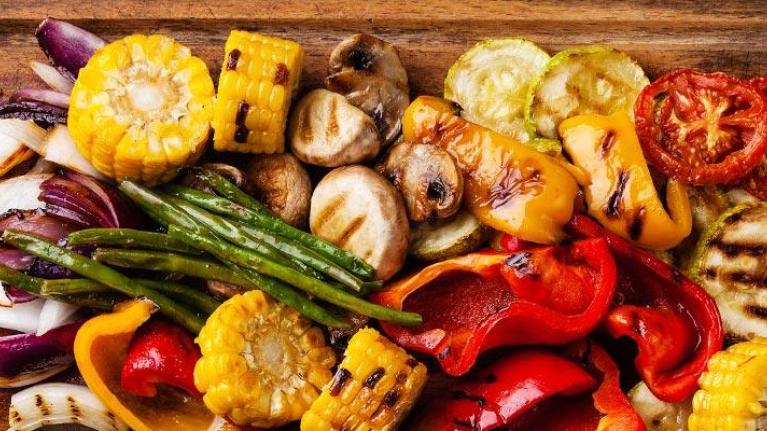 Wooden platter of grilled vegetables