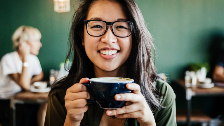 Woman drinking coffee in cafe