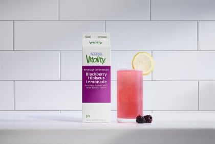 vitality blackberry hibiscus in carton and juice in glass